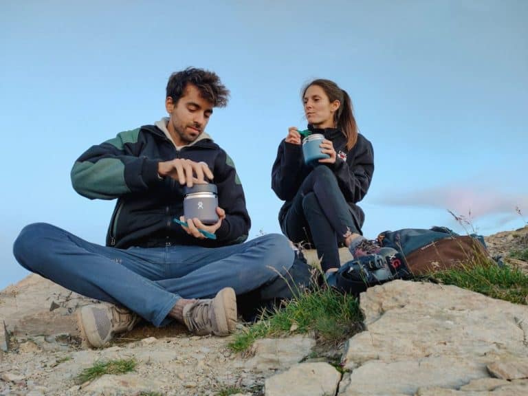 Two people enjoying a picnic on top of the Casamanya
