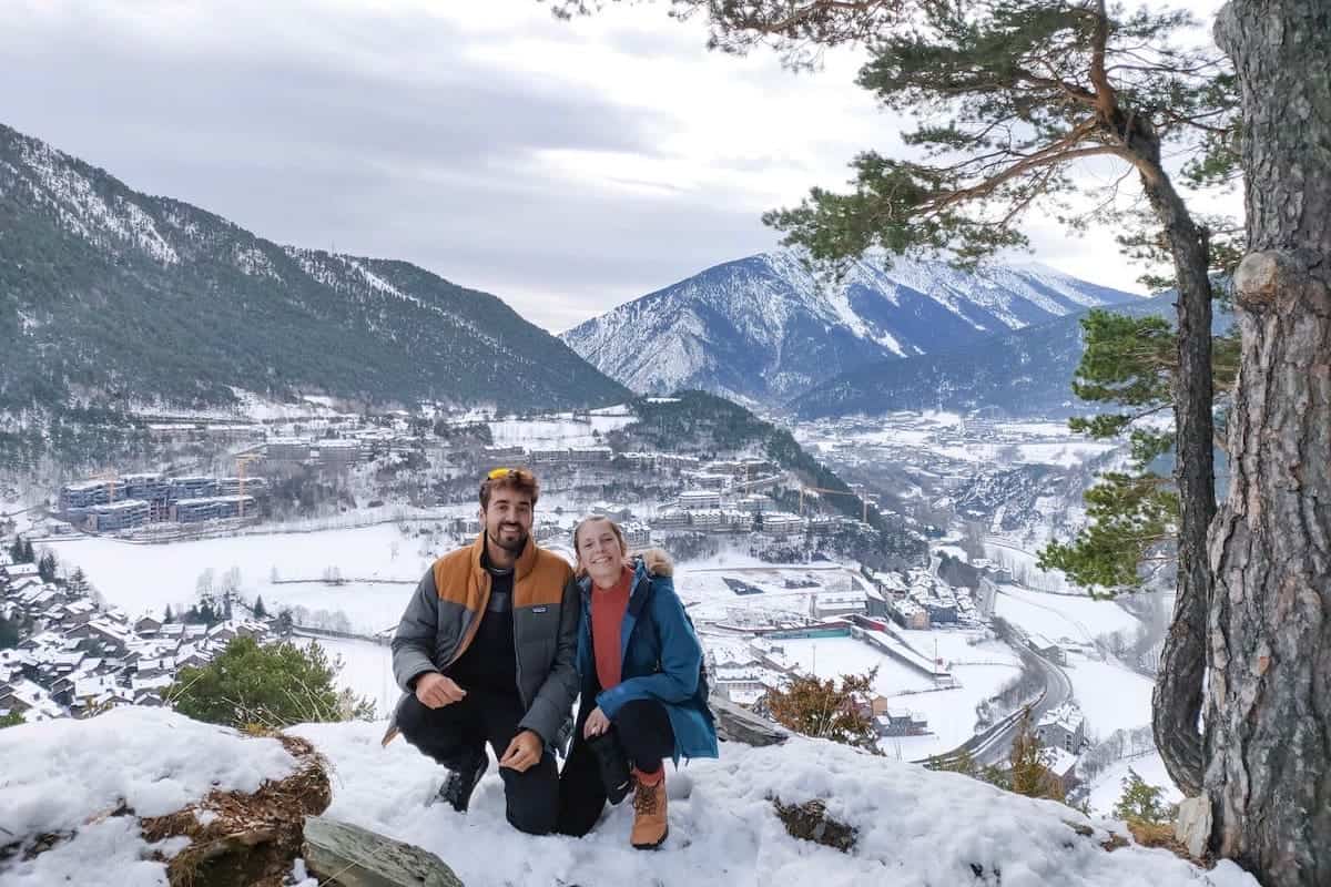 Two people on the Turer lookout during a winter hike in Andorra